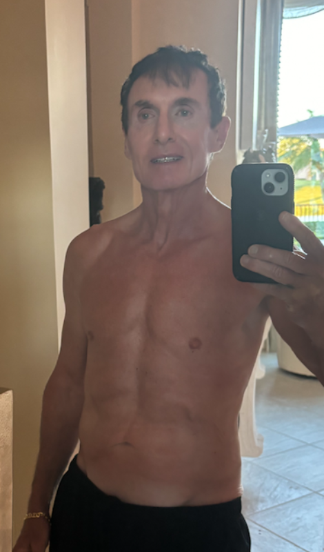 Roger Showing His Chest Muscles After His Transformation, Much More Toned Than Before